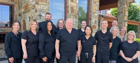 The doctors and team in front of the dental office