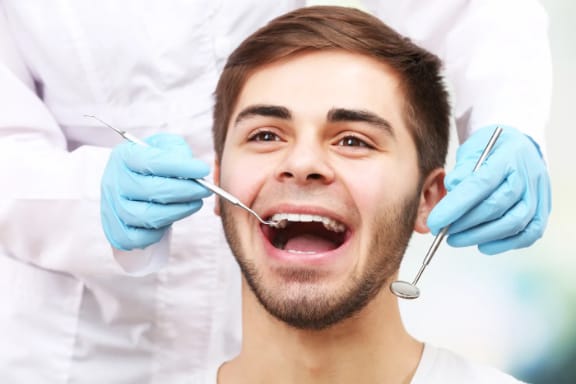 A patient smiling during a dental visit